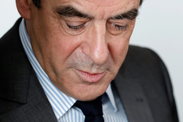 French presidential election candidate for the right-wing Les Republicains (LR) party Francois Fillon looks on during a meeting with the head of France's UDI political party at his campaign headquarters in Paris on March 14, 2017