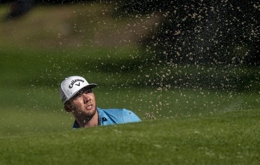 PACIFIC PALISADES, CA - FEBRUARY 18, 2021: Leader Sam Burns watches his balls flight out of a green side bunker on the 12th hole during the first round of the Genesis Open at Riviera Country Club on February 18, 2021 in Pacific Palisades, California. He holds a two shot lead at 7 under par.(Gina Ferazzi / Los Angeles Times)