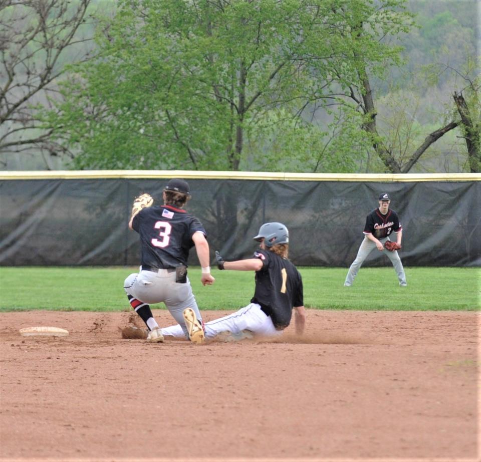 River View's Slater Sampsel slides in under a tag during a 9-4 win over Coshocton on Thursday.