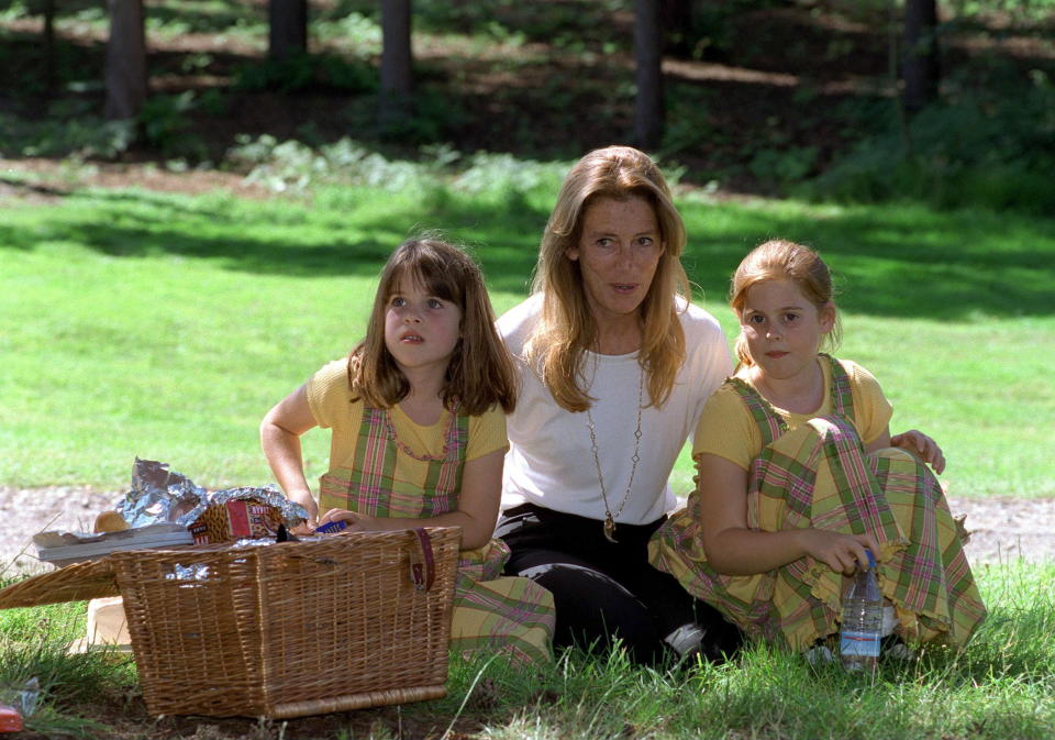 WENTWORTH, UNITED KINGDOM - JULY 20:  Princess Beatrice And Princess Eugenie With Their  Grandmother, Susan Barrantes, Enjoying A Picnic At Wentworth Golf Course During A Charity Golf Tournament On Behalf Of Children In Crisis.  (Photo by Tim Graham Photo Library via Getty Images)