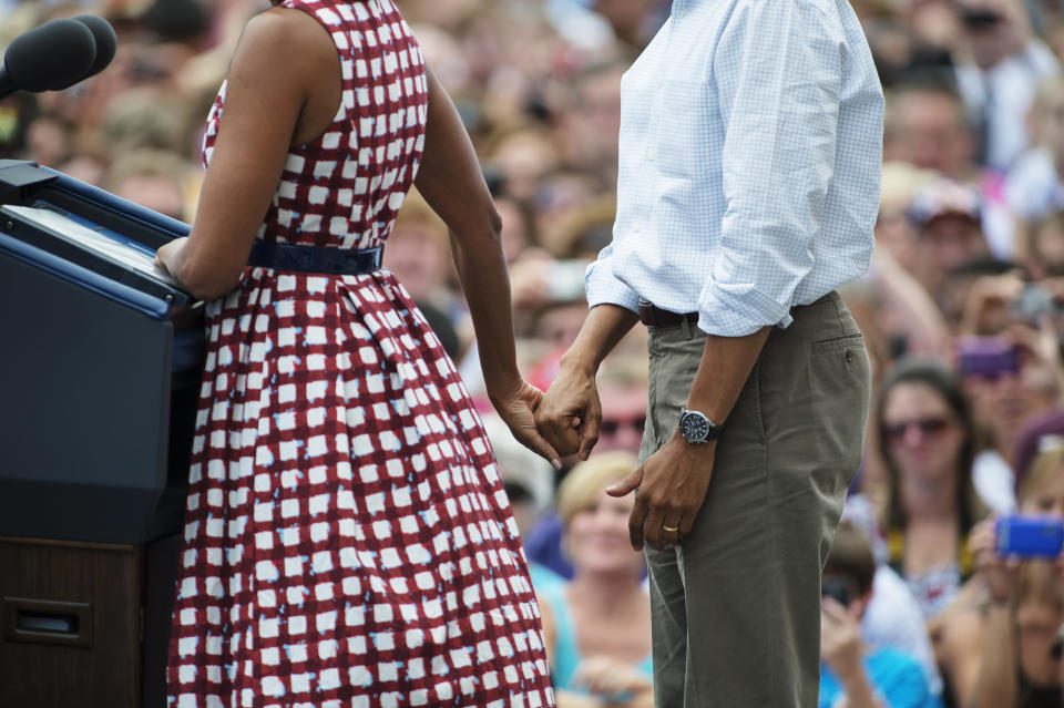 Michelle Obama and President Barack Obama speak during a rally at Alliant Energy Amphitheater in Dubuque, Iowa on Aug. 15, 2012.