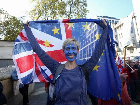 An anti-Brexit campaigner takes part in last year’s People’s Vote march (PA)