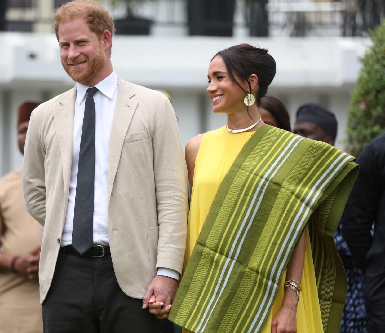 britain's prince harry 2ndr, duke of sussex, and britain's meghan r, duchess of sussex, react as lagos state governor, babajide sanwo olu unseen, gives a speech at the state governor house in lagos on may 12, 2024 as they visit nigeria as part of celebrations of invictus games anniversary photo by kola sulaimon afp