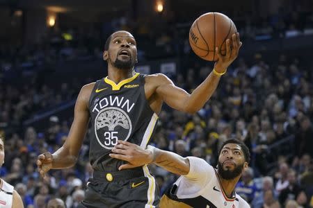 FILE PHOTO: January 16, 2019; Oakland, CA, USA; Golden State Warriors forward Kevin Durant (35) shoots the basketball against New Orleans Pelicans forward Anthony Davis (23) during the third quarter at Oracle Arena. Mandatory Credit: Kyle Terada-USA TODAY Sports