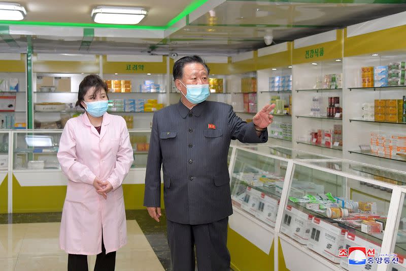 Choe Ryong Hae, chairman of the standing committee of the North Korean Supreme People's Assembly (SPA), inspects a pharmacy amid the coronavirus disease (COVID-19) pandemic, in Pyongyang