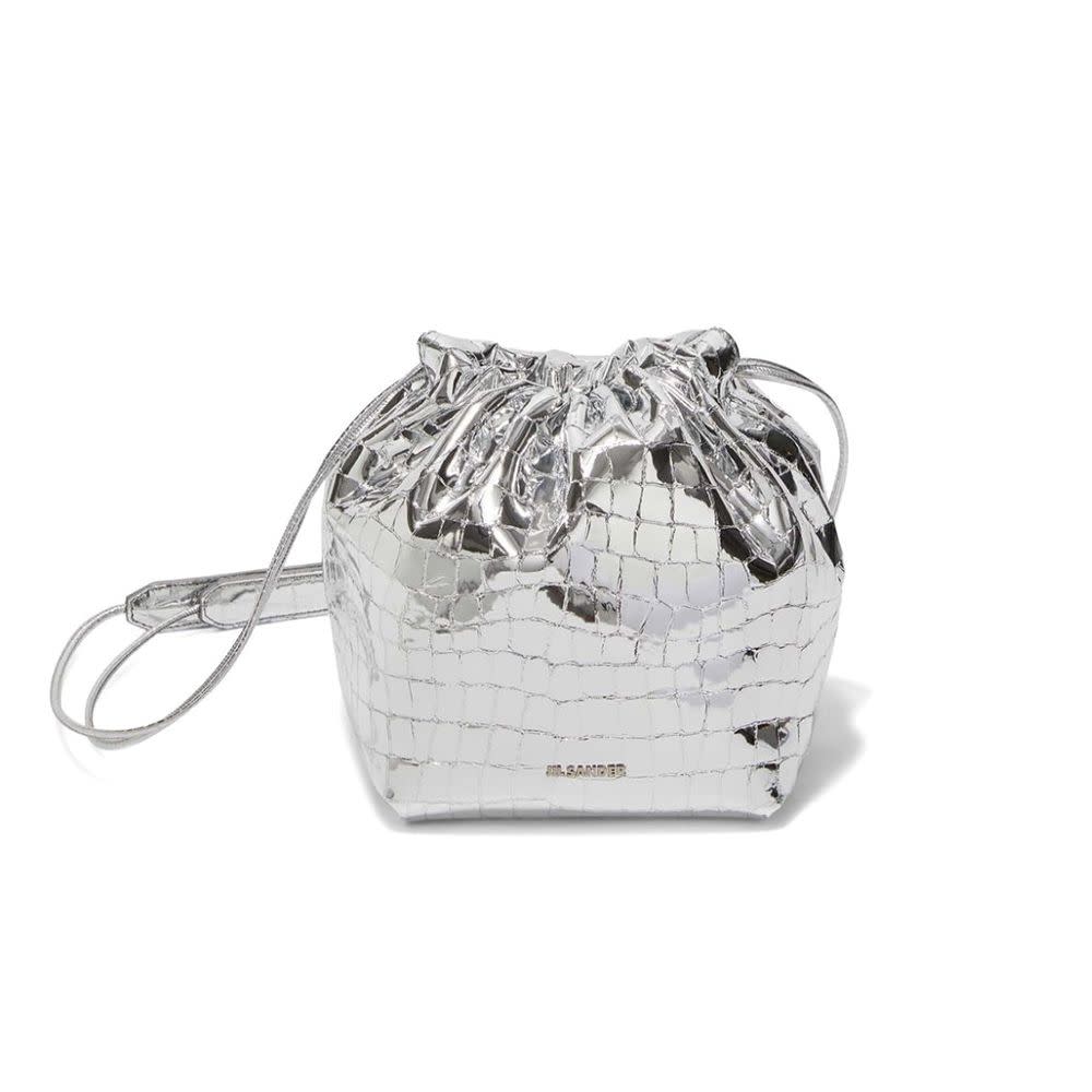 <p><a href="https://go.redirectingat.com?id=74968X1596630&url=https%3A%2F%2Fwww.neimanmarcus.com%2Fp%2Fjil-sander-dumpling-metallic-croc-print-crossbody-bag-prod267350093&sref=https%3A%2F%2Fwww.elle.com%2Ffashion%2Fshopping%2Fg60114249%2Fbest-metallic-bags%2F" rel="nofollow noopener" target="_blank" data-ylk="slk:Shop Now;elm:context_link;itc:0;sec:content-canvas" class="link rapid-noclick-resp">Shop Now</a></p><p>Dumpling Metallic Croc-Print Crossbody Bag </p><p>Neiman Marcus</p><p>$1400.00</p>