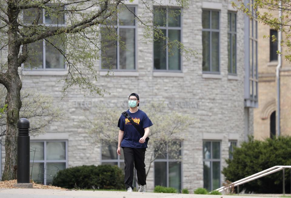 A Lawrence University student walks across campus Wednesday.