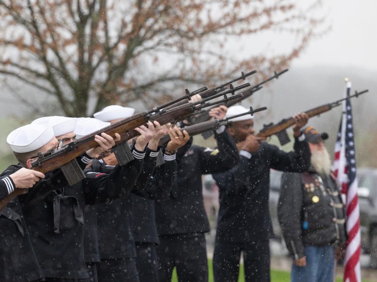 A gun salute is fired Thursday for U.S. Navy Fireman 1st Class Walter Schleiter during his military funeral at National Cemeteries of the Alleghanies. Schleiter died while serving aboard the USS Oklahoma battleship on Dec. 7, 1941, which was moored in Pearl Harbor.