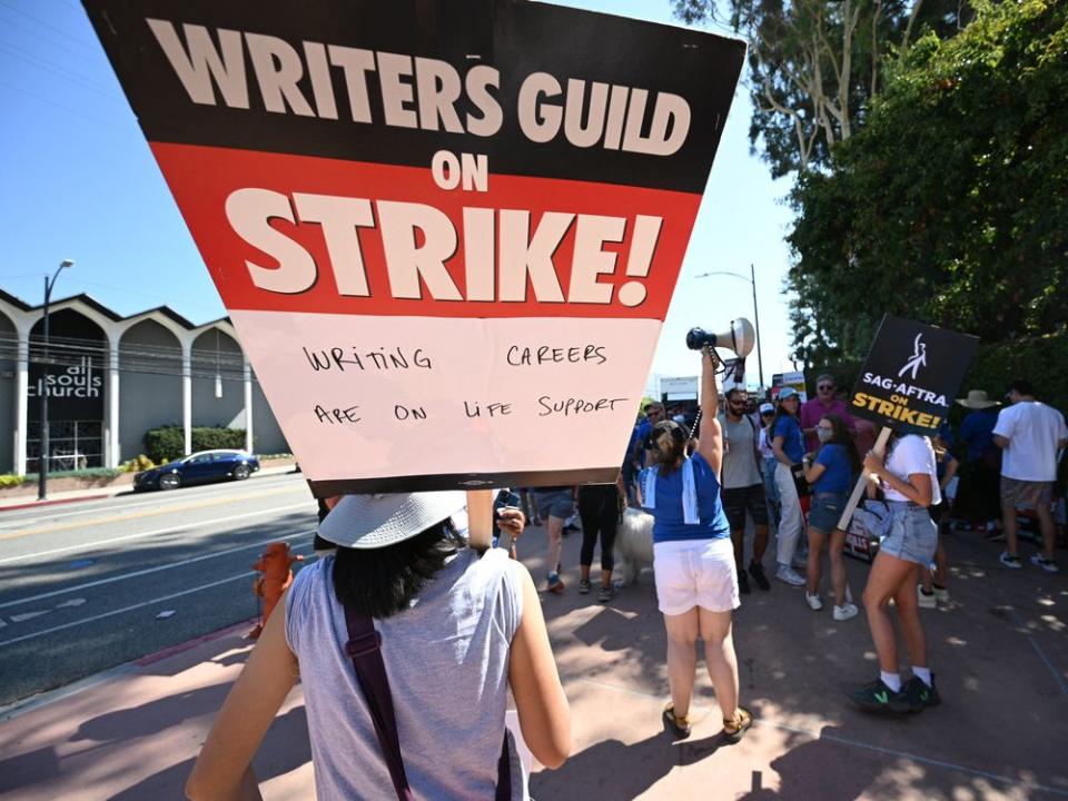  Hollywood actors, writers and their supporters walk the picket line July 18, outside Disney Studios, in Burbank, Calif.