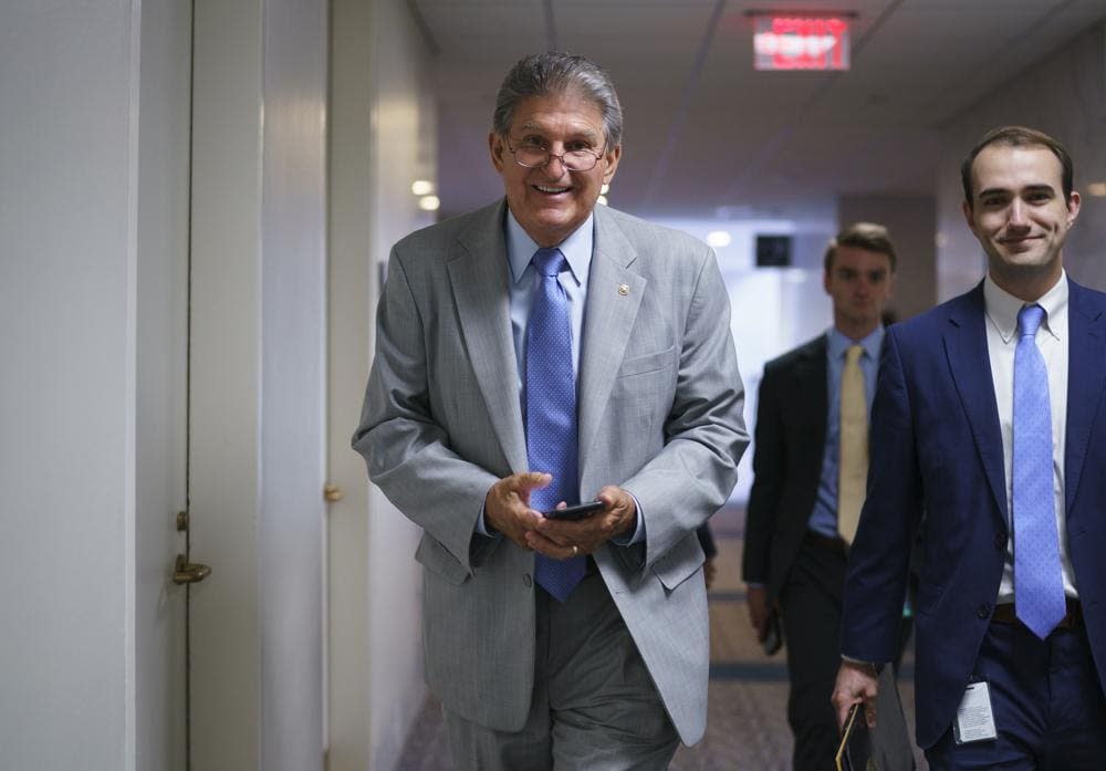 Sen. Joe Manchin, D-W.Va., a key negotiator in the infrastructure talks, arrives at his office on Capitol Hill in Washington, Monday, June 21, 2021. (AP Photo/J. Scott Applewhite)