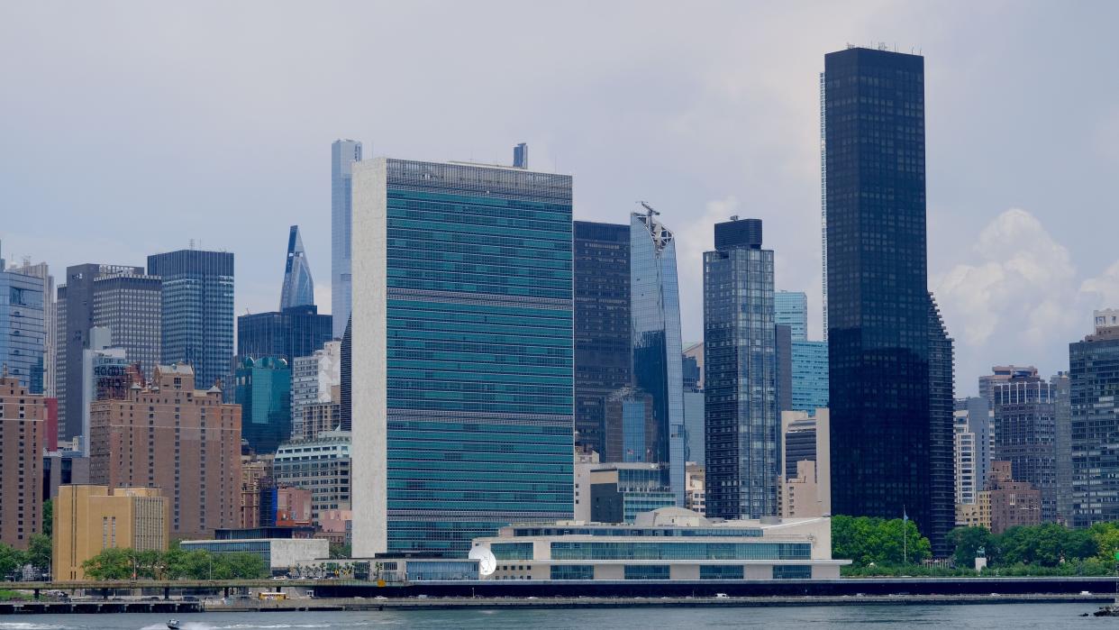 A view of the United Nations, center, and Midtown Manhattan buildings from Long Island City, Queens.