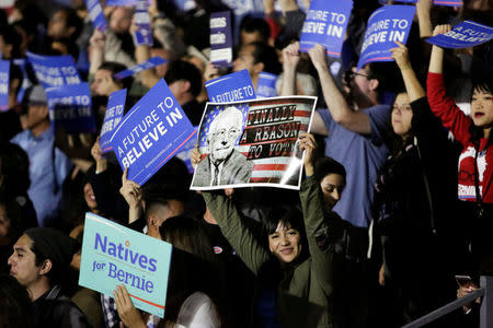 Supporters gather to see U.S. Democratic presidential candidate Bernie Sanders speak during a election night rally in Santa Monica, California, U.S. June 7, 2016. REUTERS/Jason Redmond