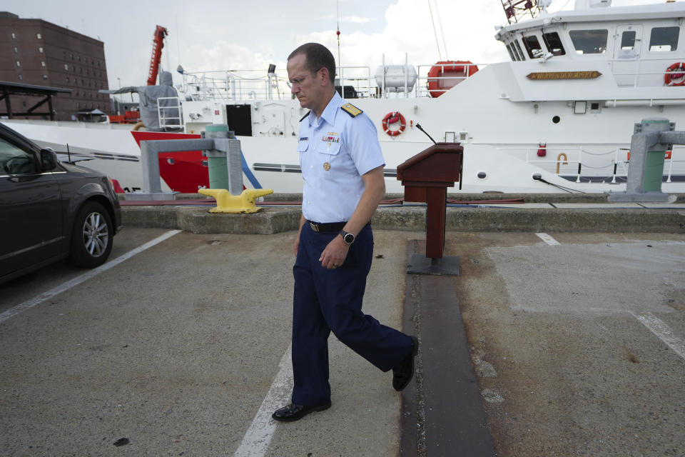 U.S. Coast Guard Rear Adm. John Mauger, commander of the First Coast Guard District, steps away from a podium following a news conference, Sunday, June 25, 2023, at Coast Guard Base Boston, in Boston. The U.S. Coast Guard said it is leading an investigation into the loss of the Titan submersible that was carrying five people to the Titanic, to determine what caused it to implode. (AP Photo/Steven Senne)