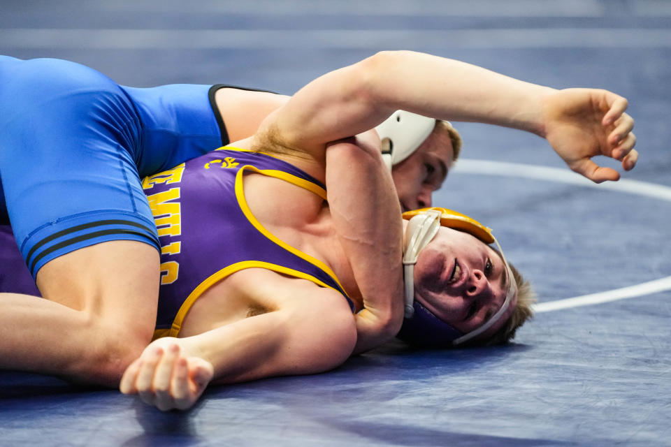 Underwood’s Gable Porter, top, wrestles Lake Mills’s Steven Brandenburg at 132 pounds during the second round of the Class 1A of the Iowa high school state wrestling tournament at Wells Fargo Arena.