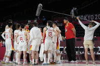 China's Yao Ming, second from right, stands in the huddle with the women's team during a timeout in a women's basketball quarterfinal game against Serbia at the 2020 Summer Olympics, Wednesday, Aug. 4, 2021, in Saitama, Japan. (AP Photo/Eric Gay)