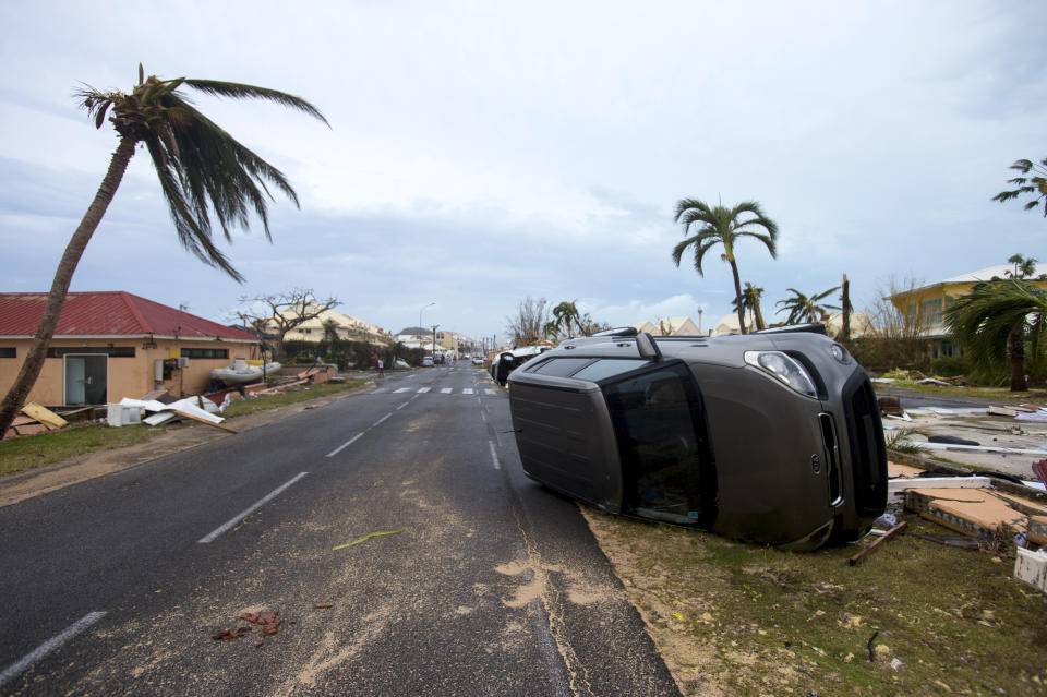 <p>A car is turned onto its side in Marigot, near the Bay of Nettle, on the French Collectivity of Saint Martin, after the passage of Hurricane Irma on Sept. 6, 2017. (Photo: Lionel Chamoiseau/AFP/Getty Images) </p>