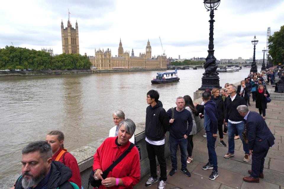 Members of the public in the queue on the South Bank near to Lambeth Bridge as they wait to view the Queen’s lying in state (Jacob King/PA) (PA Wire)