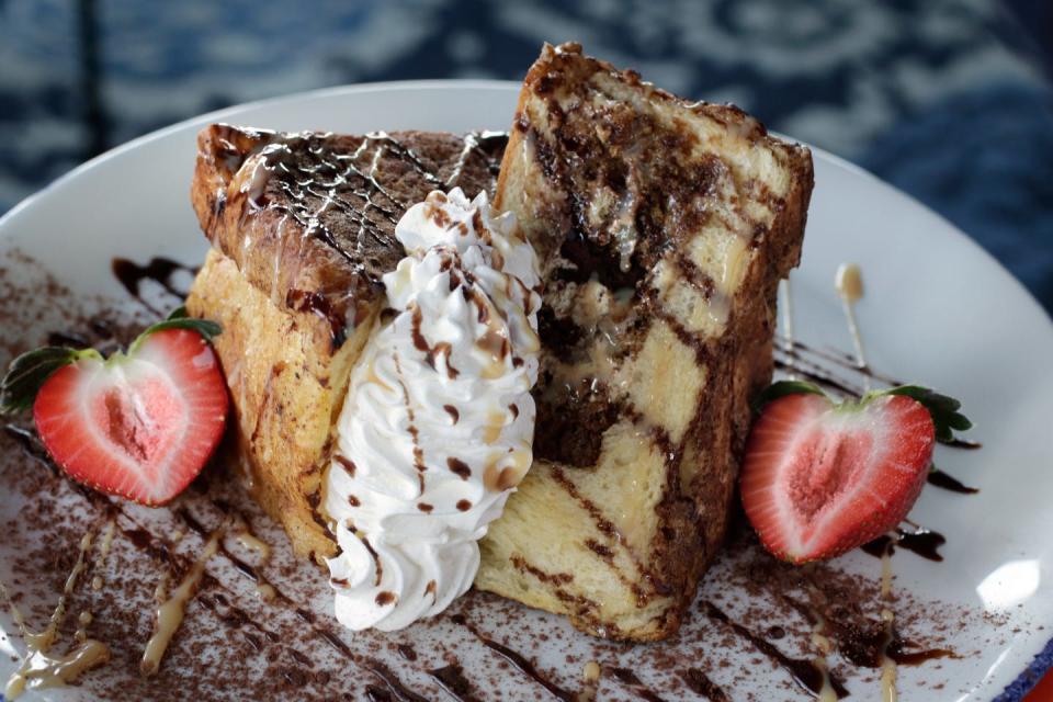 Tiramisu Stuffed French Toast is on Blu Violet's brunch menu, which is served Saturday and Sunday. It includes rum and Kahlua plus cocoa syrup.