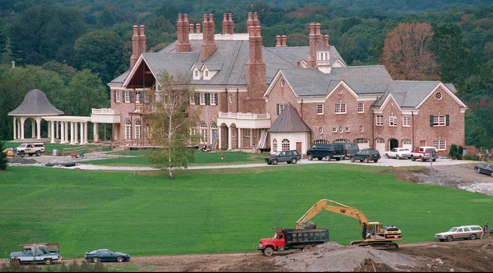 This is the mansion that once stood on an empty parcel now for sale in Bedford. Mariah Carey and her former husband Tommy Mottola built the house in 1993; it burned down in 1999.