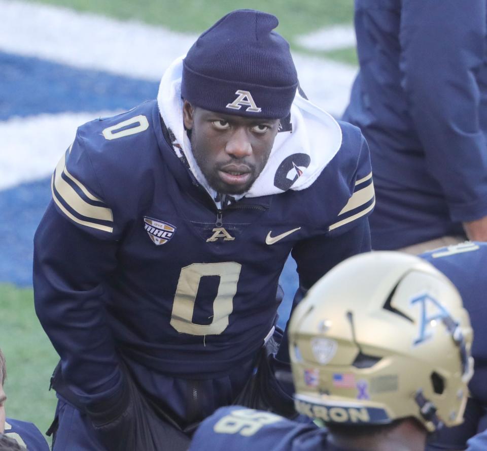 Akron quarterback DJ Irons listens to a conversation on the sidelines during the second quarter of the game against Northern Illinois, Saturday, Oct. 7, 2023. Irons is out for the season with a torn ACL.