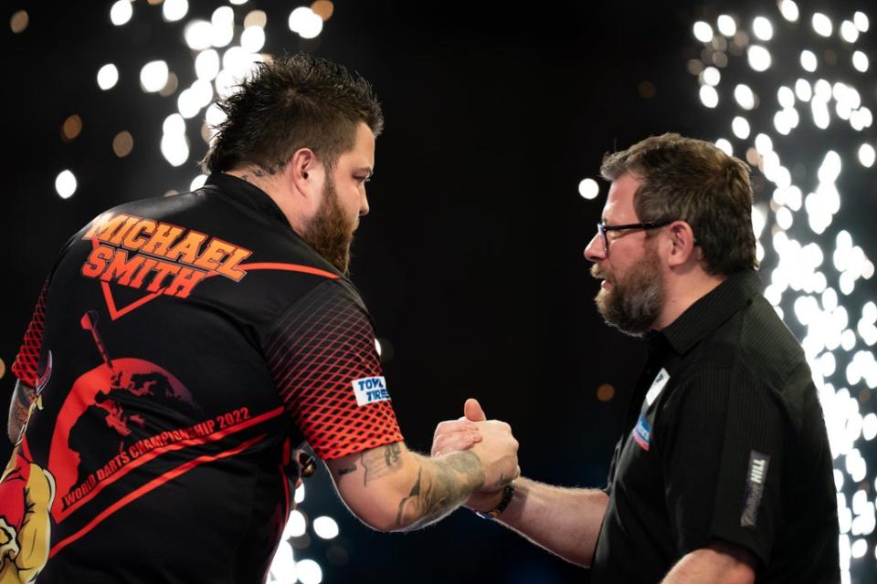 Michael Smith (left) held off a fightback from James Wade (right) (Aaron Chown/PA) (PA Wire)