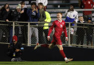 Indiana's Ryan Wittenbrink celebrates after scoring a goal during the first half of the team's NCAA men's soccer tournament semifinal against Pittsburgh in Cary, N.C., Friday, Dec. 9, 2022. (AP Photo/Ben McKeown)