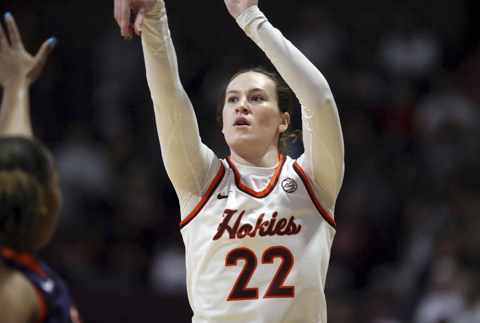 Virginia Tech's Cayla King (22) shoots a 3-point basket in the first half of an NCAA college basketball game against Clemson in Blacksburg, Va, Sunday, Jan. 21, 2024. (Matt Gentry/The Roanoke Times via AP)