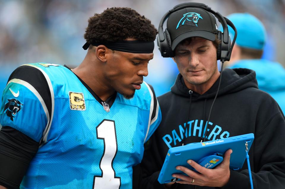 Carolina Panthers quarterback Cam Newton (1) chats with quarterbacks coach Ken Dorsey during a 2017 game against the Atlanta Falcons.