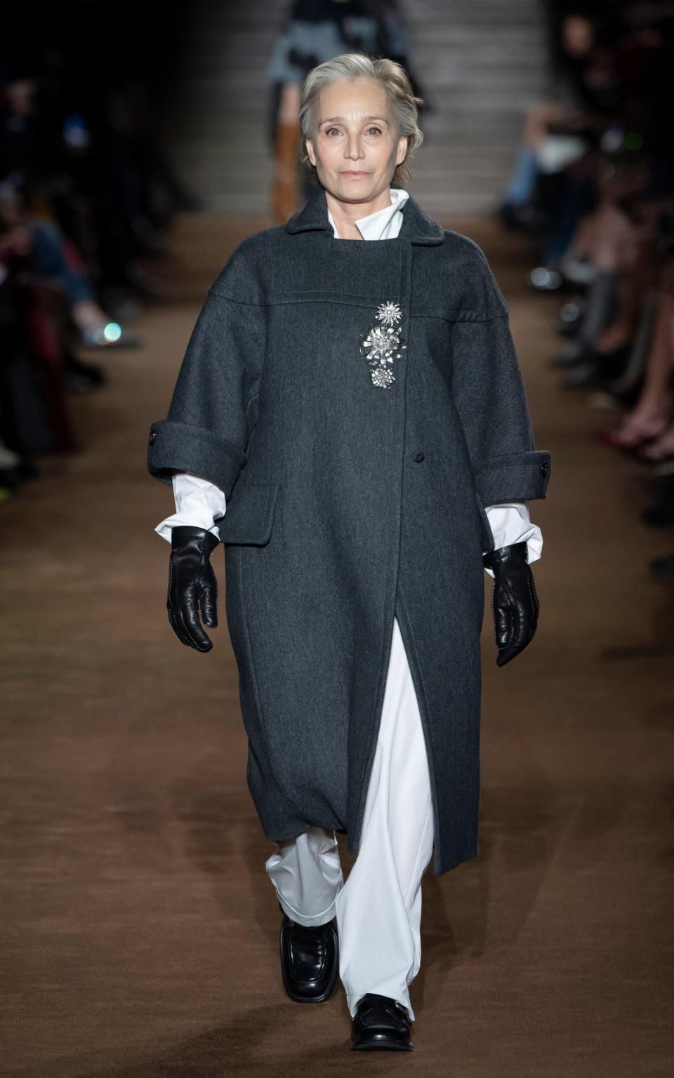 Kristin Scott Thomas walks the runway for Miu Miu during Paris Fashion Week in March