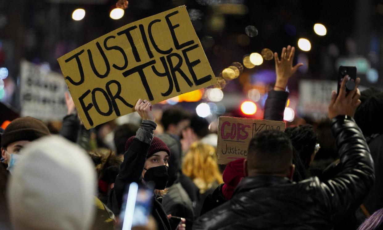 <span>People hold signs during a protest in New York in 2023, following the release of videos showing Memphis police officers beating Tyre Nichols.</span><span>Photograph: David Dee Delgado/Reuters</span>