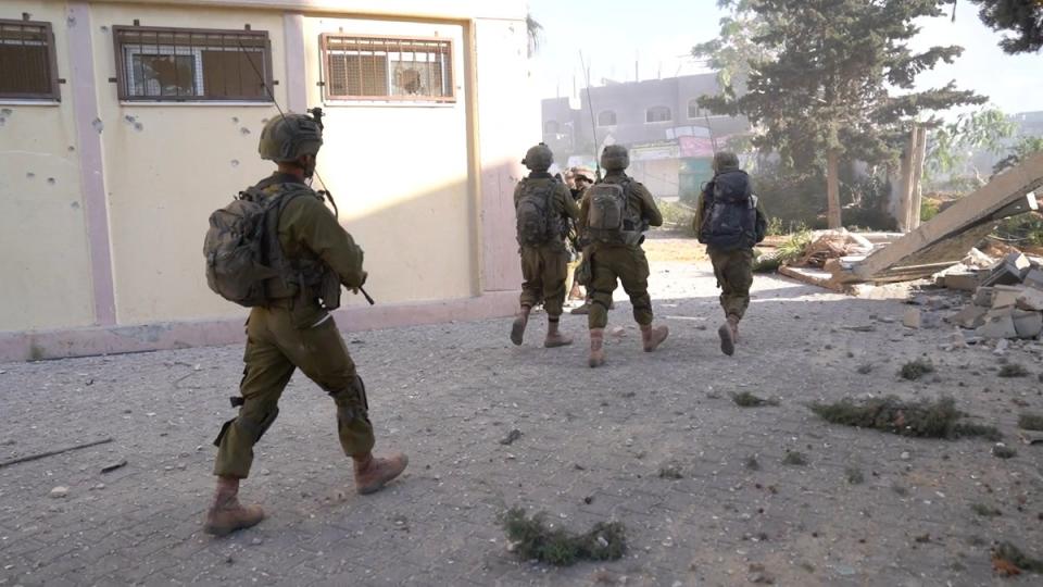 Israeli soldiers operate in a location given as Gaza, amid the ongoing ground operation of the Israeli army (via REUTERS)