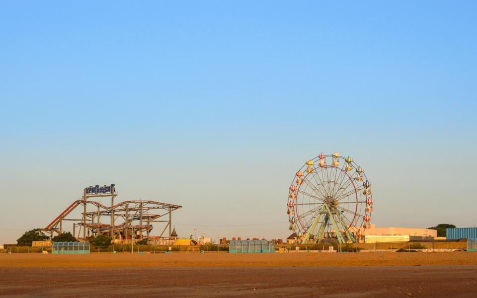 Skegness beach, the big wheel and the fair ground, early morning