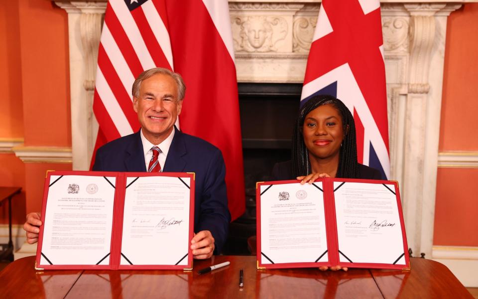 Kemi Badenoch, the Business and Trade Secretary, and Greg Abbott, the Governor of Texas, sign a trade deal this afternoon