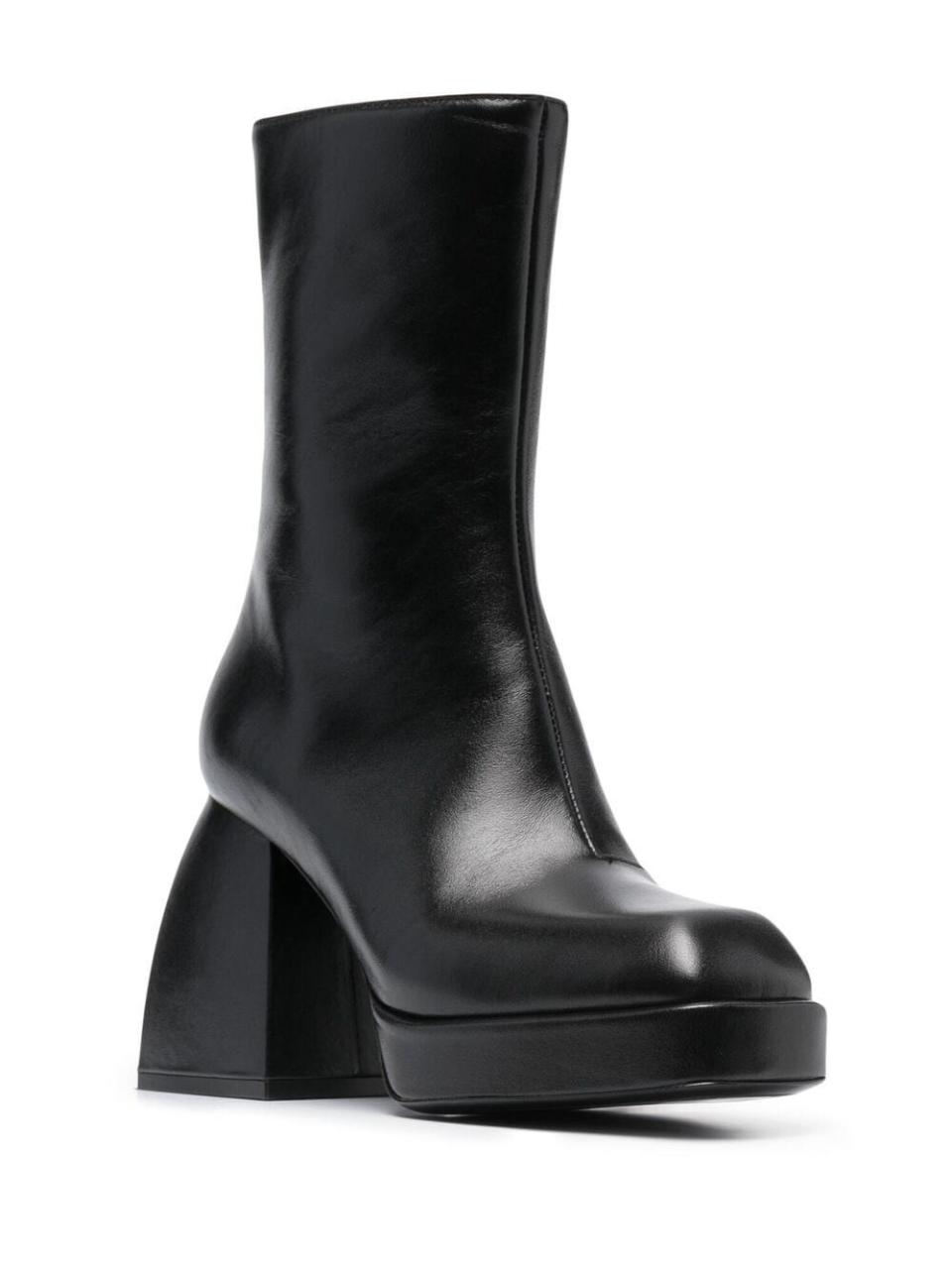 <p><a href="https://go.redirectingat.com?id=74968X1596630&url=https%3A%2F%2Fwww.farfetch.com%2Fshopping%2Fwomen%2Fnodaleto-block-heel-leather-boots-item-16679984.aspx&sref=https%3A%2F%2Fwww.harpersbazaar.com%2Fcelebrity%2Flatest%2Fa60382839%2Fzoe-kravitz-platform-boots-high-fidelity%2F" rel="nofollow noopener" target="_blank" data-ylk="slk:Shop Now;elm:context_link;itc:0;sec:content-canvas" class="link ">Shop Now</a></p><p>Block-Heel Leather Boots</p><p>farfetch.com</p><p>$930.00</p>