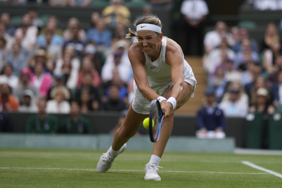 Victoria Azarenka of Belarus plays a return to Ukraine's Elina Svitolina during the women's singles match on day seven of the Wimbledon tennis championships in London, Sunday, July 9, 2023. (AP Photo/Alastair Grant)