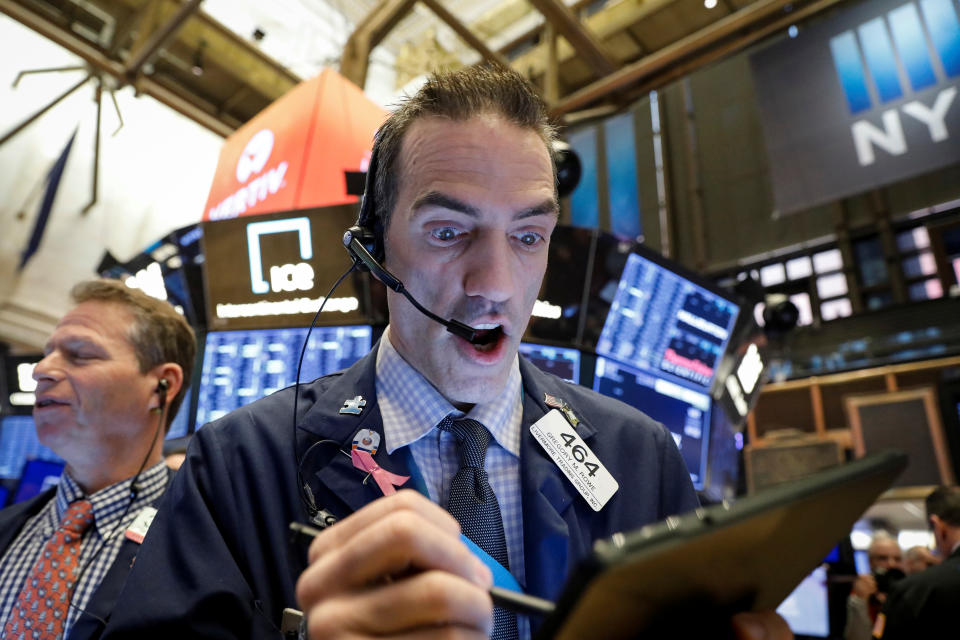 Traders work on the floor at the New York Stock Exchange (NYSE) in New York, U.S., February 28, 2020. REUTERS/Brendan McDermid