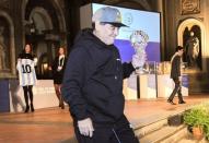 Argentinian soccer legend Diego Armando Maradona holds the prize received during the Italian soccer Hall of Fame 2017 event in Florence, Italy, January 17, 2017. REUTERS/Paolo Lo Debole