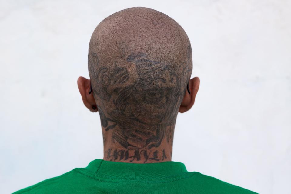 El Paso Chicano rap artist Fabian Primera 'Payaso915' shows the tattoo art that he has on his head and neck on Saturday, May 20, 2023.