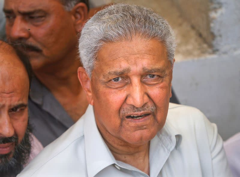 FILE PHOTO: Pakistani nuclear scientist photograph after a media silent prayer over the grave of his brother during his funeral services in Karachi