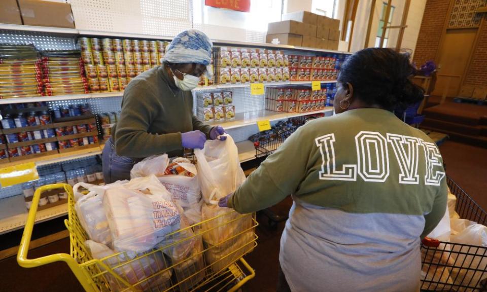 Volunteers Brenda Chambers, left, and Theretha Dixon at the Brightmoor Connection Food Pantry in Detroit.