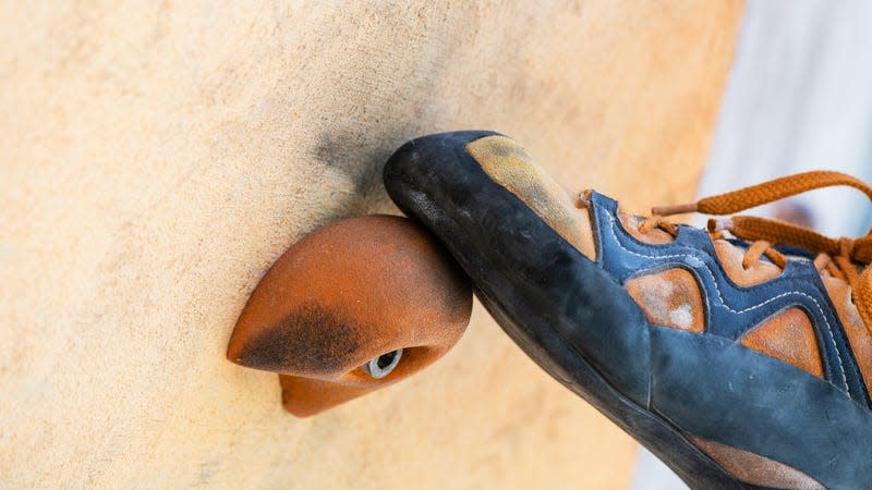 A close-up of a person’s climbing shoes. - Image: O_Lypa (Shutterstock)