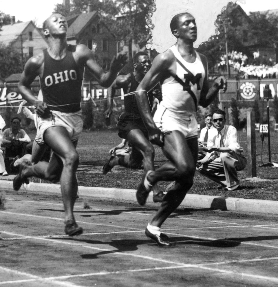 Here is the finish line of the 100 meter dash in the AAU circuit at Marquette Stadium and Ralph Metcalfe of Marquette, the world's fastest human, is shown holding the tape one step ahead of Jesse Owens of Ohio State.  It was the third time Metcalfe won the event in the AAU