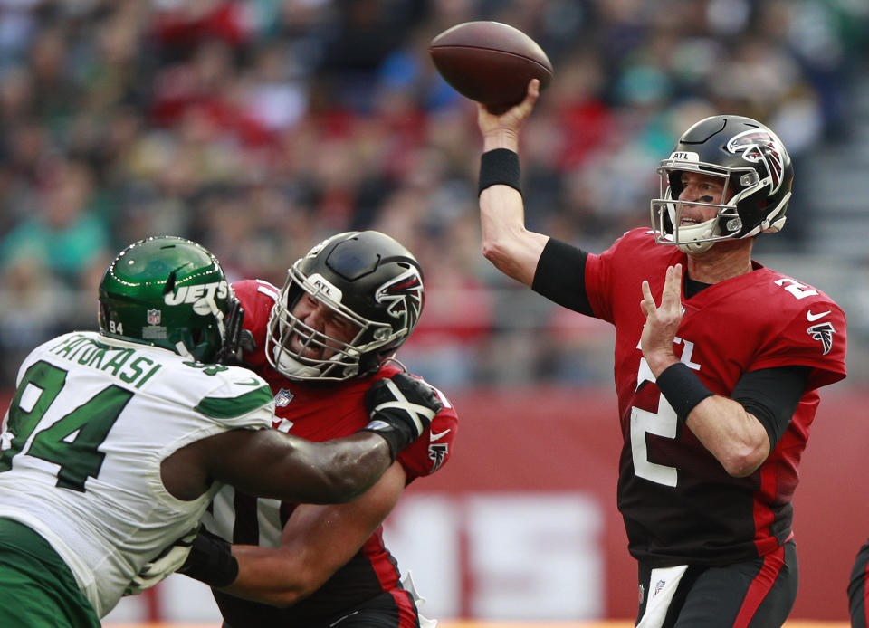 Atlanta Falcons quarterback Matt Ryan (2) passes the ball during an NFL football game between the New York Jets and the Atlanta Falcons at the Tottenham Hotspur stadium in London, England, Sunday, Oct. 10, 2021. (AP Photo/Ian Walton)