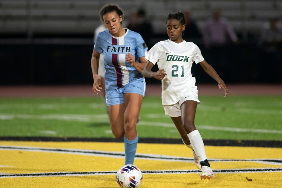 Faith Christian senior defender Bella Forker and Dock Mennonite junior Ceara Barnes run for the ball in PIAA District One Class 1A championship game at Central Bucks West High School in Doylestown on Tuesday, Nov. 1, 2022. Dock Mennonite defeated last year's champion Faith Christian 2-1.