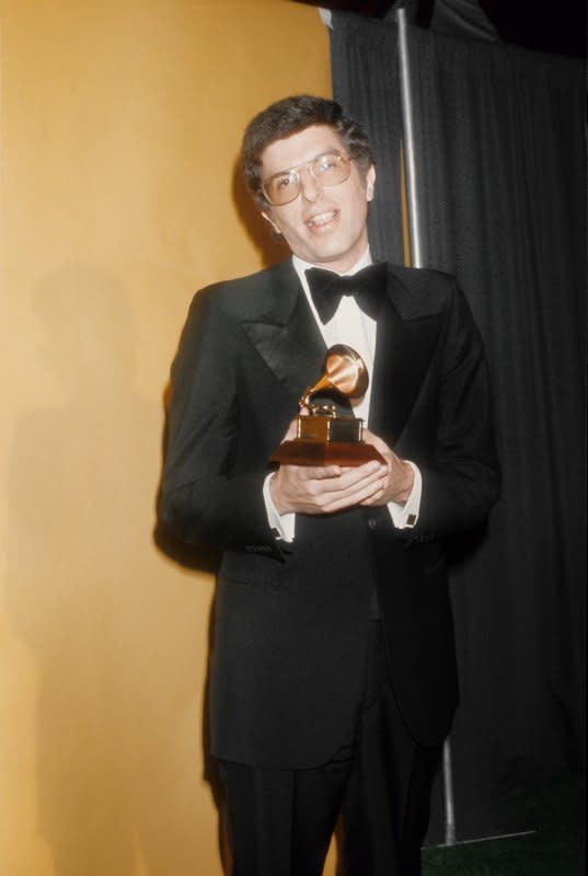 EGOT-winning composer Marvin Hamlisch poses with his Grammy backstage on Feb. 28, 1976. <p>Michael Ochs Archives/Getty Images</p>