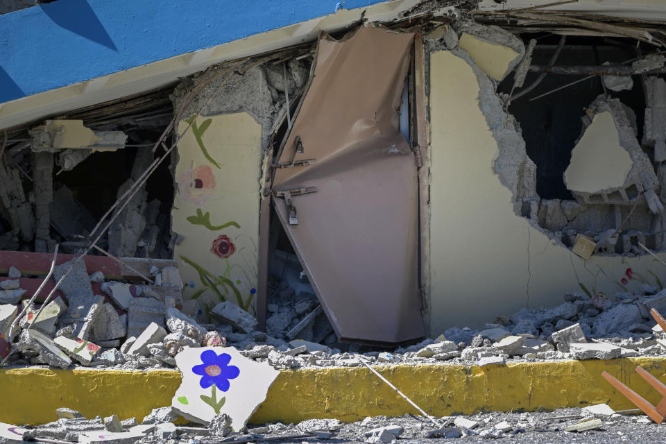 The Adripina Seda public school stands partially collapsed after an earthquake struck Guanica, Puerto Rico, Tuesday, Jan. 7, 2020. A 6.4-magnitude earthquake struck Puerto Rico before dawn on Tuesday, killing one man, injuring others and collapsing buildings in the southern part of the island. (AP Photo/Carlos Giusti)