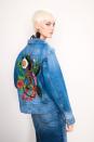 <p>A model wears a denim jacket with a sequin and crystal martini monkey embroidered on the back. (Photo: Courtesy of Oscar de la Renta) </p>