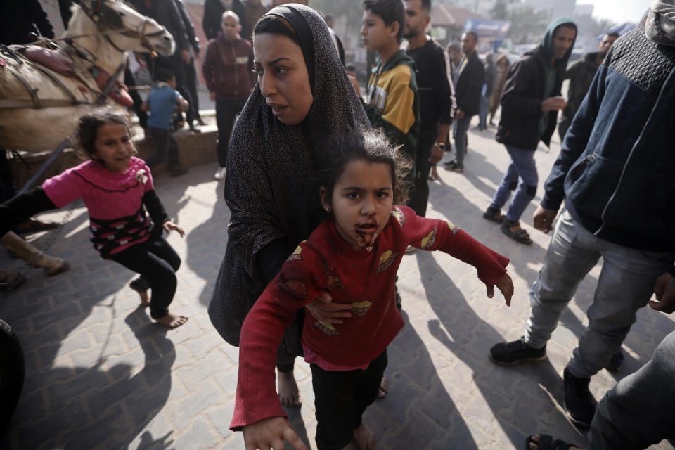 Palestinians wounded during the Israeli bombardment of the Gaza Strip are brought to the Nasser hospital in Khan Younis, Southern Gaza Strip, Monday, Jan. 22, 2024. (AP Photo/Mohammed Dahman)