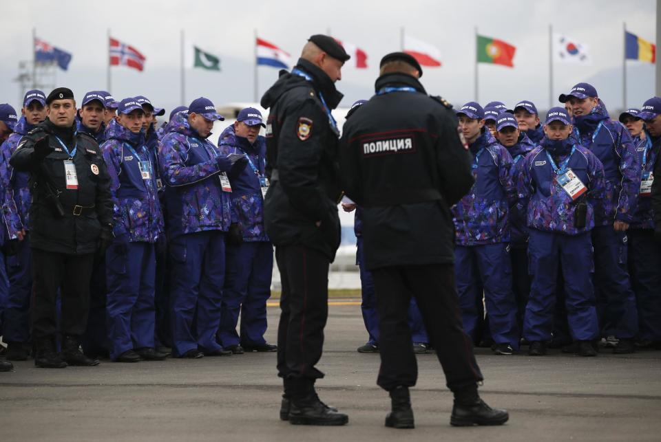 Russian security personnel wait for deployment in the Olympic Park as security measures continue to be implemented for the 2014 Winter Olympics, Thursday, Jan. 30, 2014, in Sochi, Russia. (AP Photo/Pavel Golovkin)