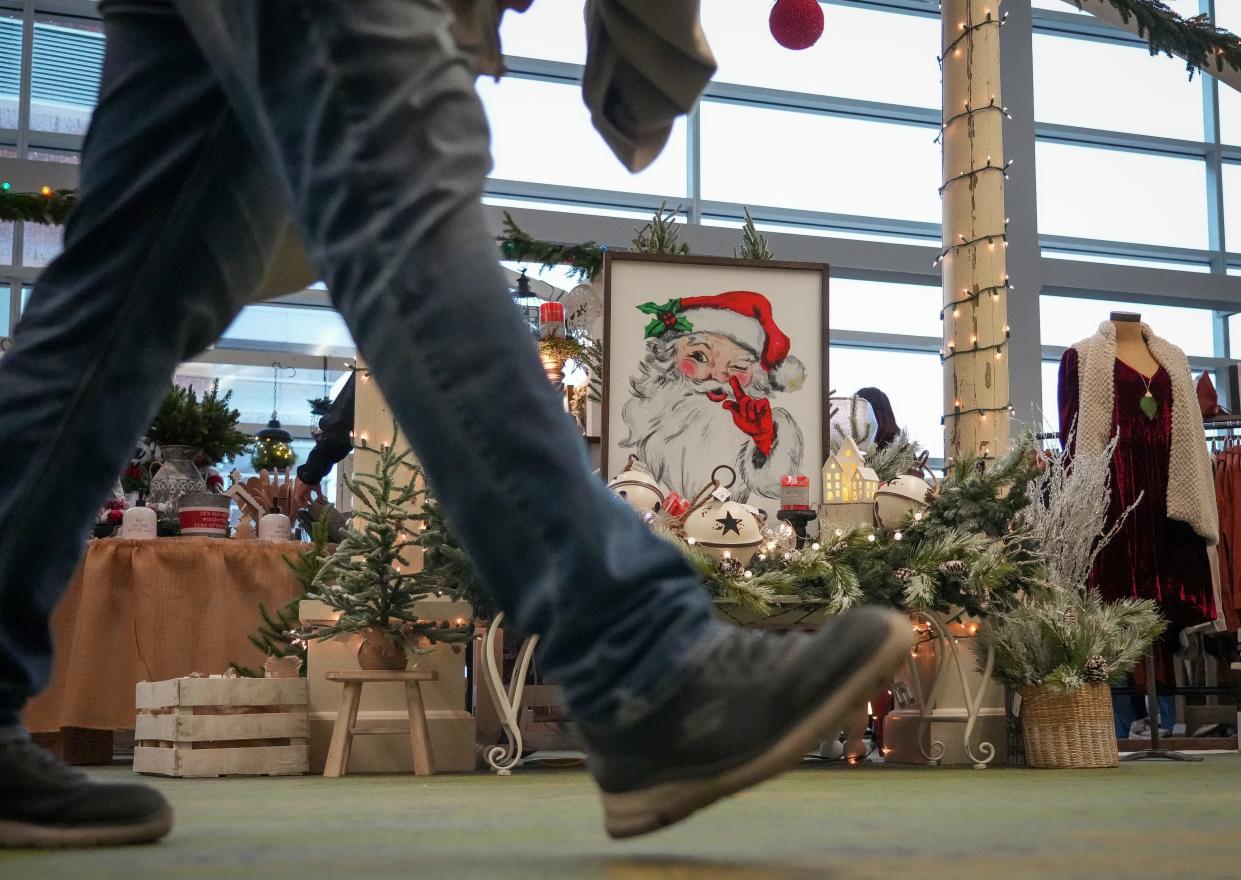 Shoppers peruse holiday crafts and items during the Holiday Boutique at the Iowa Events Center in 2022 in Des Moines.